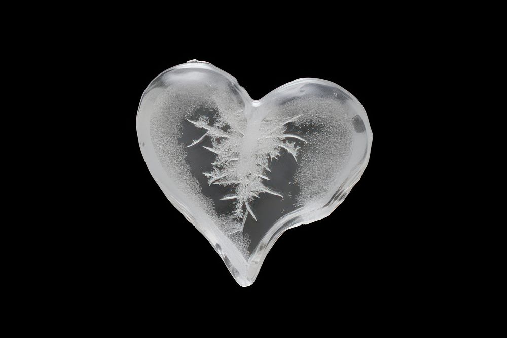 Broken heart jewelry ice black background.