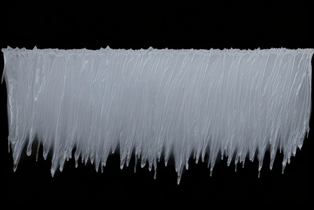 Frosted ice wall statue icicle winter black background.
