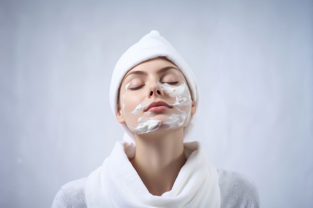 Woman shaving her face with cream by razor portrait adult towel. AI generated Image by rawpixel.