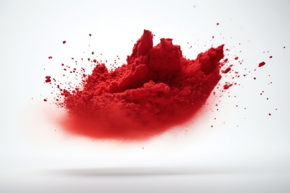 Pigment powder red splattered exploding.