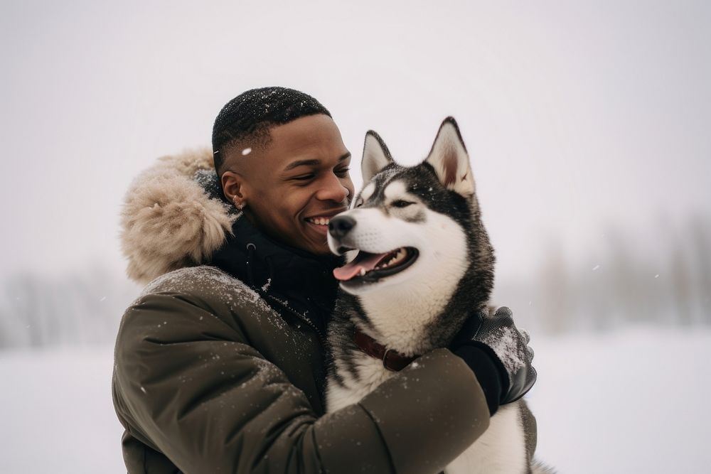 Man hugging dog snow portrait outdoors.