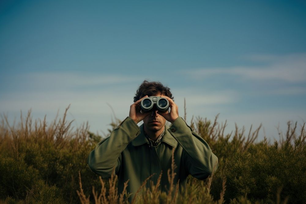 Man using Binoculars binoculars portrait adult. AI generated Image by rawpixel.