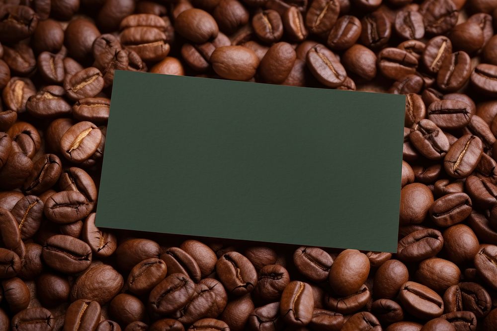 Blank green card on coffee beans