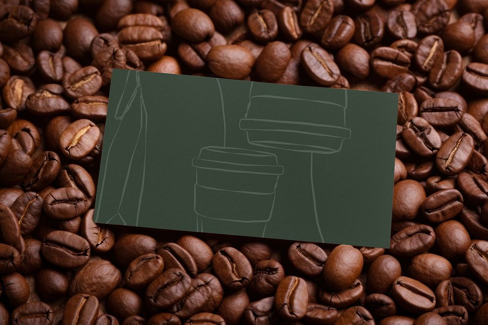 Blank green card on coffee beans