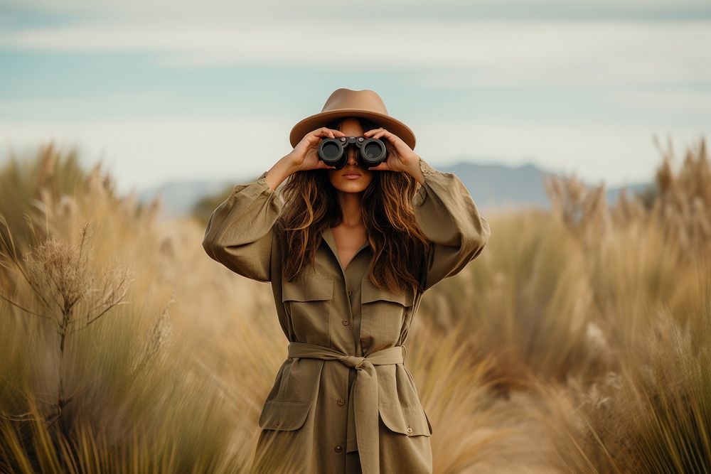 Woman using Binoculars binoculars photo photographing. AI generated Image by rawpixel.