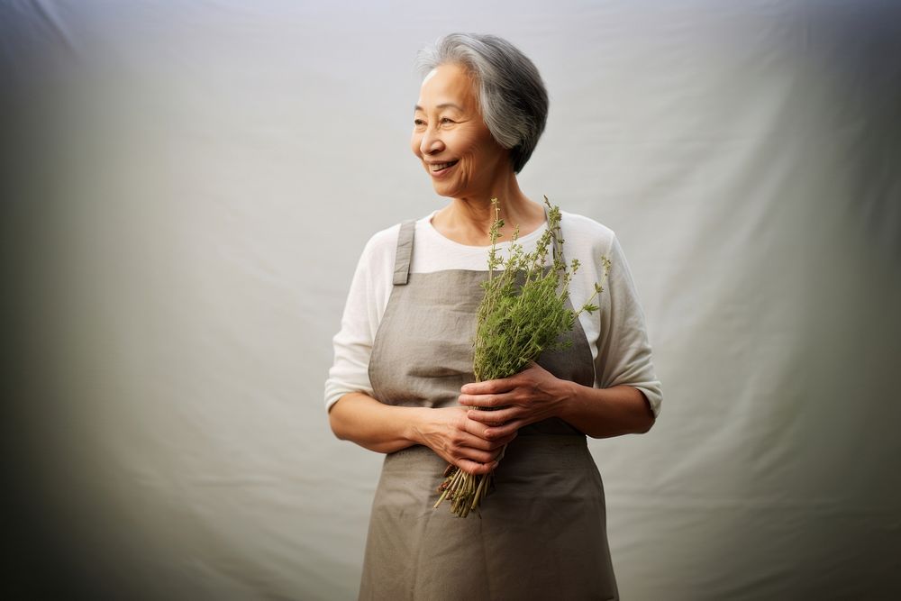 Woman holding Thyme herbs adult smile retirement.