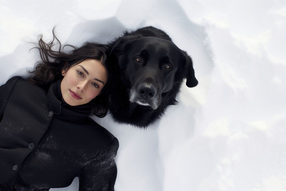 Woman with dog winter snow portrait.