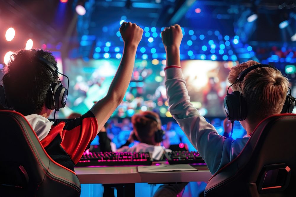 Pro Gamers Play in Video Game on a Championship Arena adult togetherness illuminated.