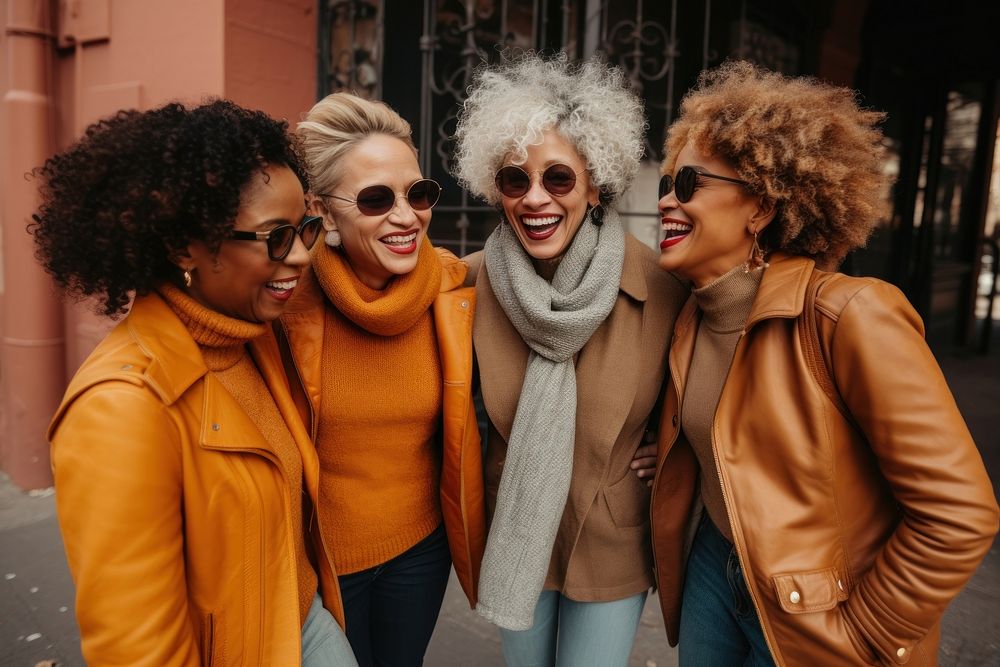 Black women laughing glasses jacket.