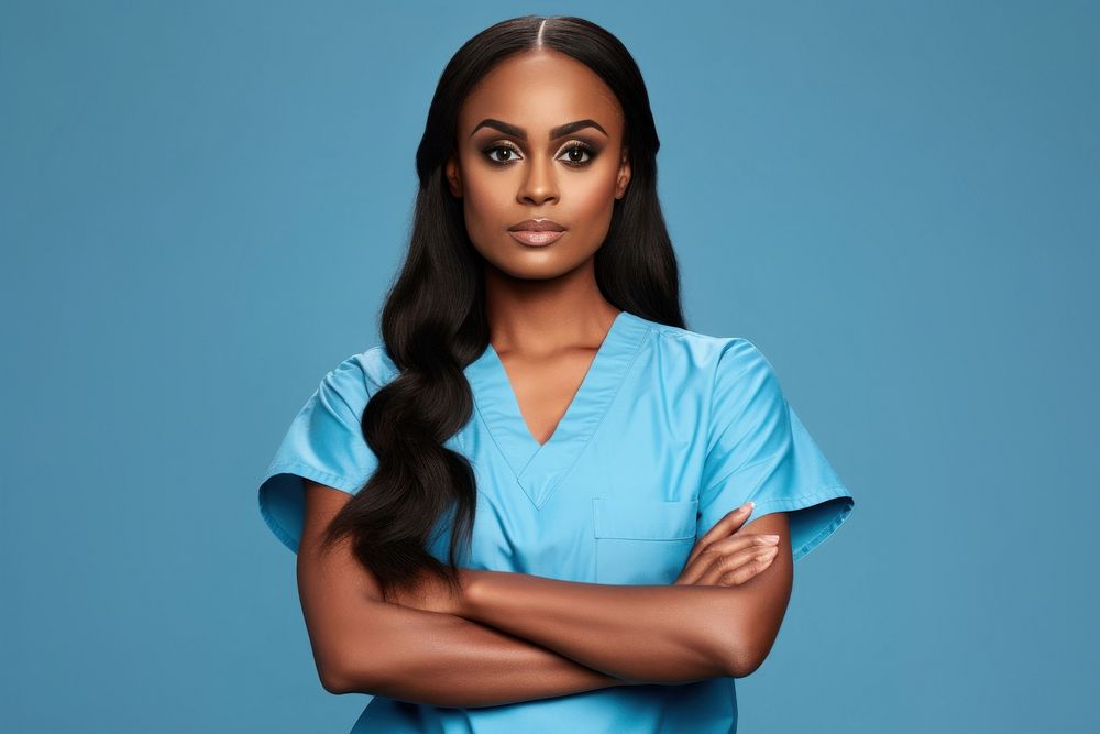 African female doctor looking up with arms crossed adult perfection hairstyle.