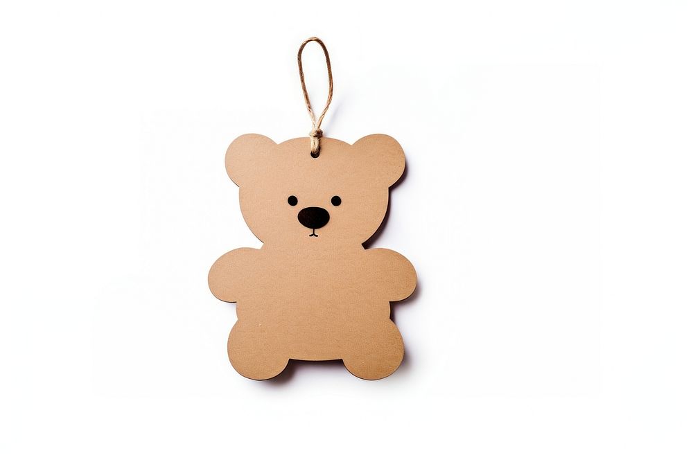 Teddy bear shaped paper gift tag brown white background representation.