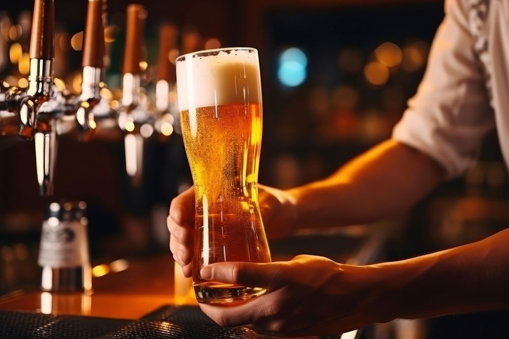 Bartender glass beer pouring.