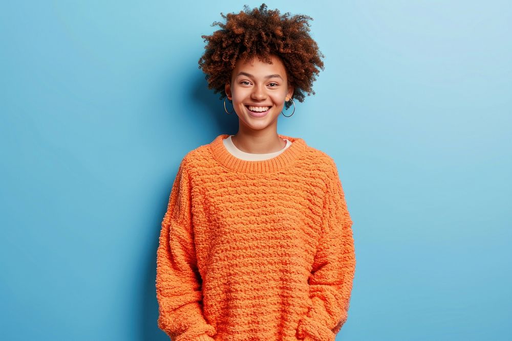 Young black woman laughing portrait sweater.