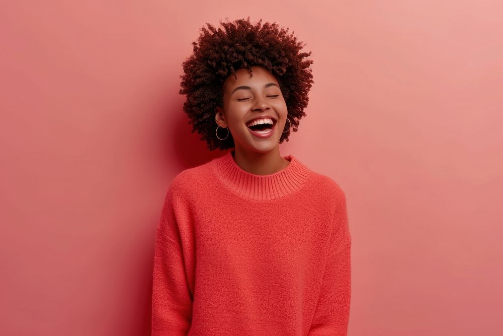 Young black woman laughing portrait sweater.