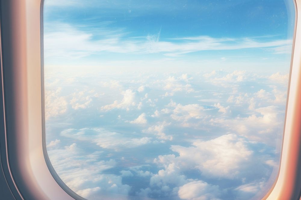 Clouds and blue sky from the airplane window cloud backgrounds porthole. AI generated Image by rawpixel.