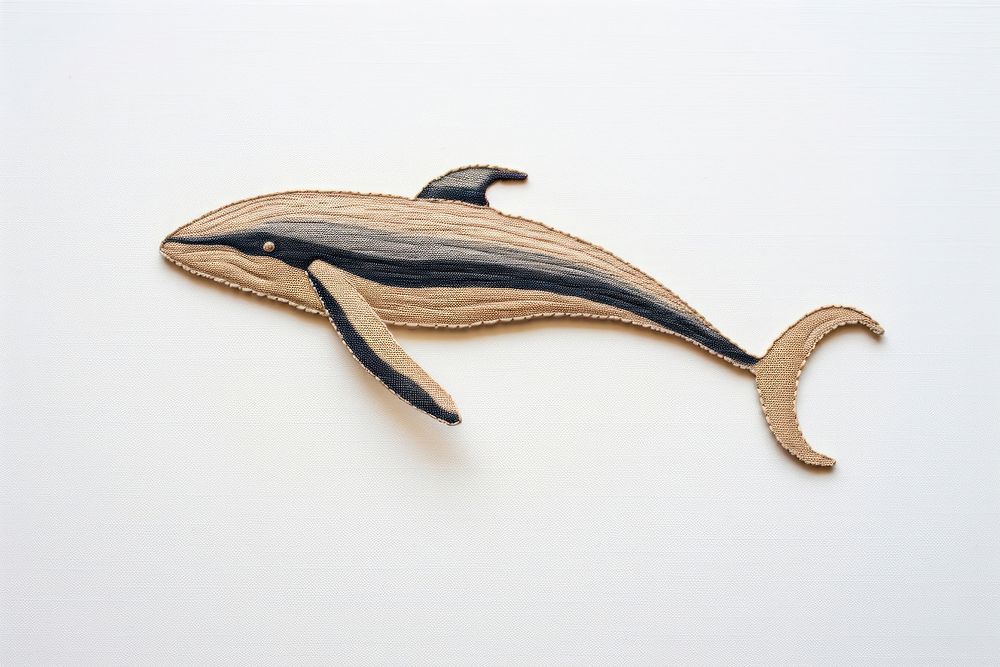 A whale in embroidery style animal mammal fish.