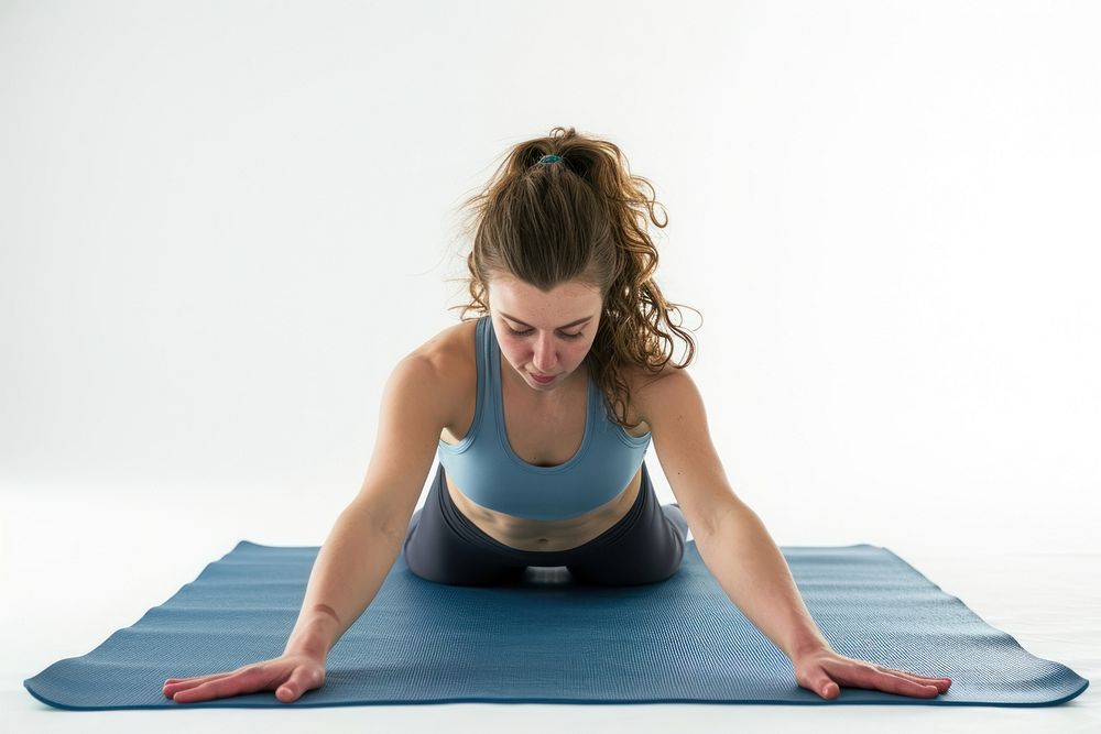 Young woman practicing yoga Yoga mat pilates sports adult.