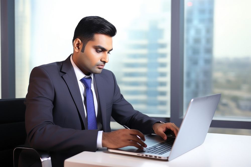 Pakistani man computer working laptop.