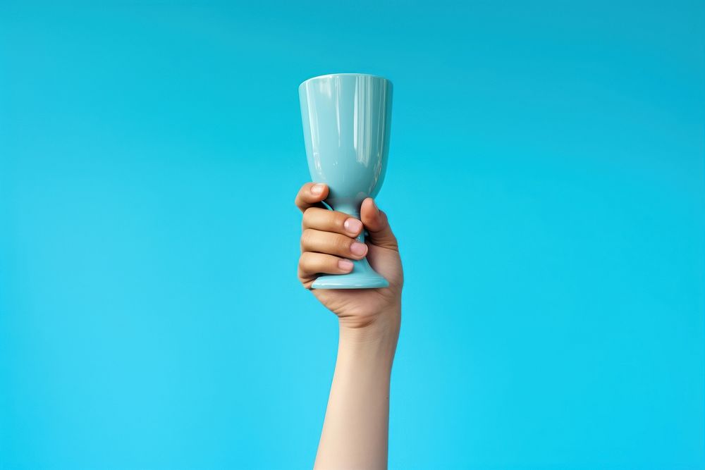Trophy cup holding glass hand. AI generated Image by rawpixel.