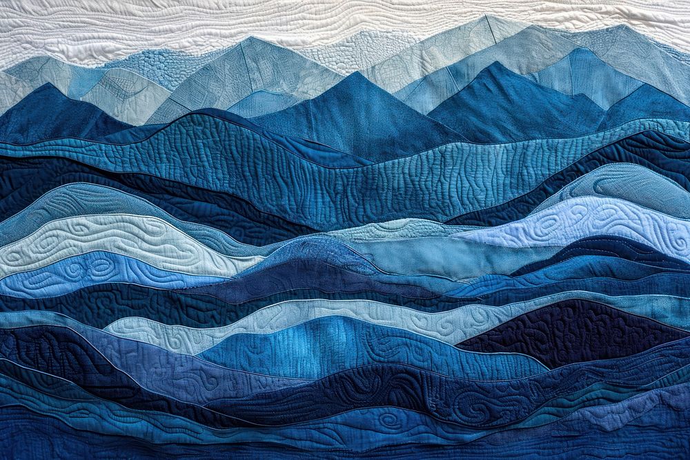 Embroidery with mountain blue tones textile craft quilt.
