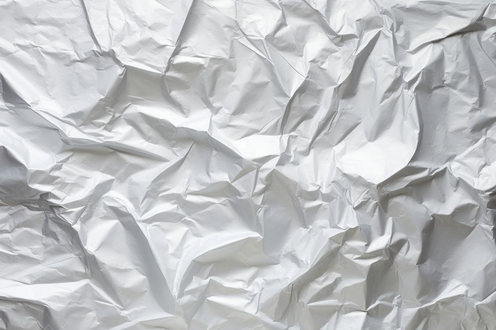 Old silver crumpled paper backgrounds aluminium wrinkled.