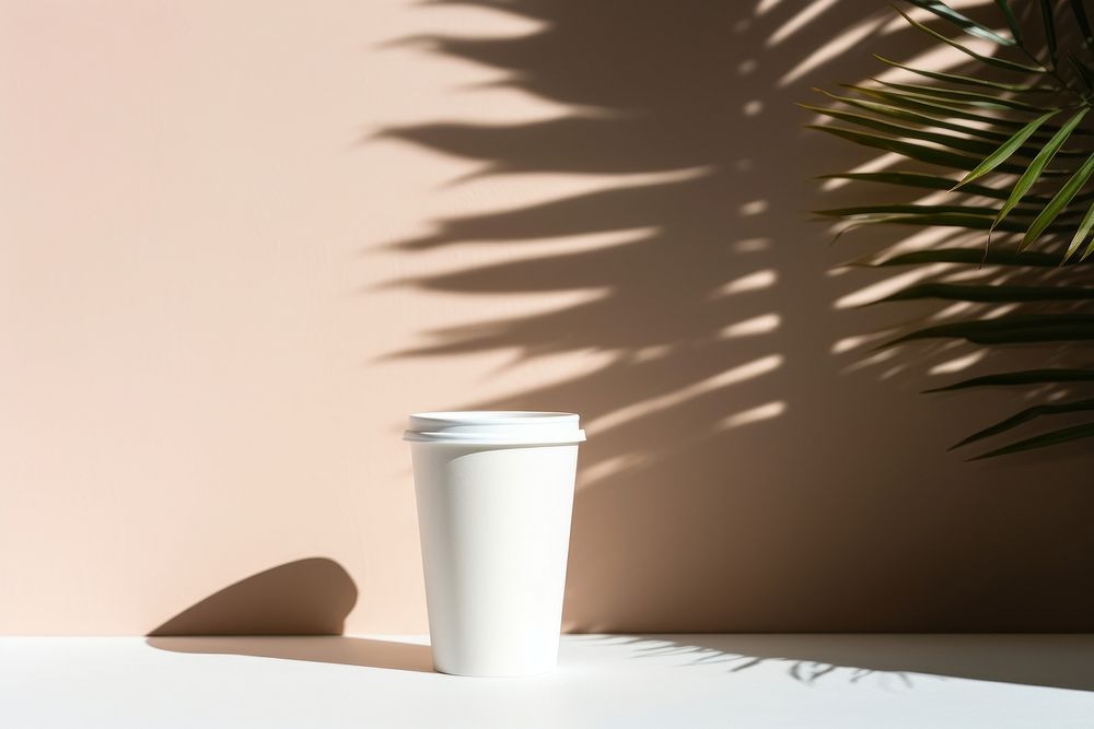 White paper coffee cup with coffee bean shadow wall mug.