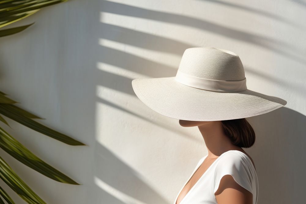 Female wearing a white hat summer adult beachwear.