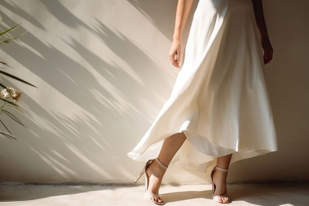 Female wearing  white apron footwear shadow dress.