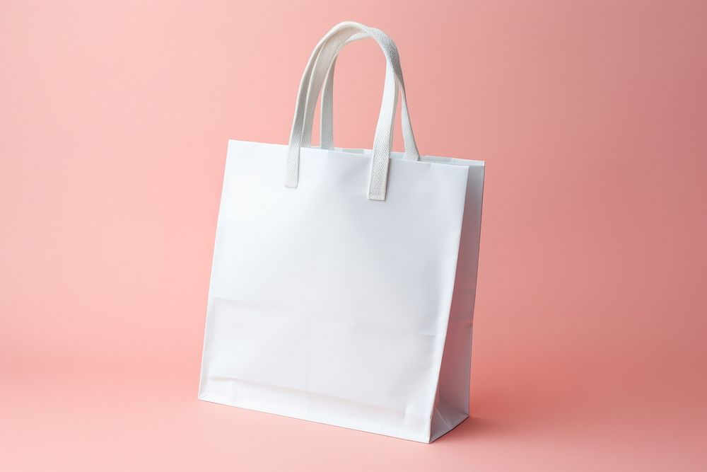 A white Shopping Bag bag handbag shopping bag.