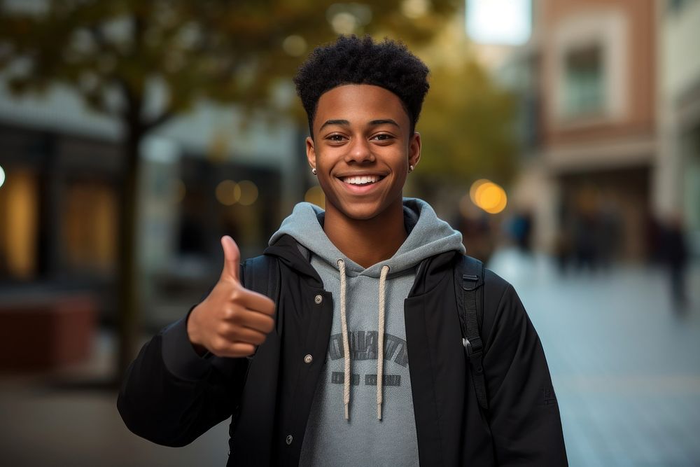 A happy african american teenager man with confident finger smile men.