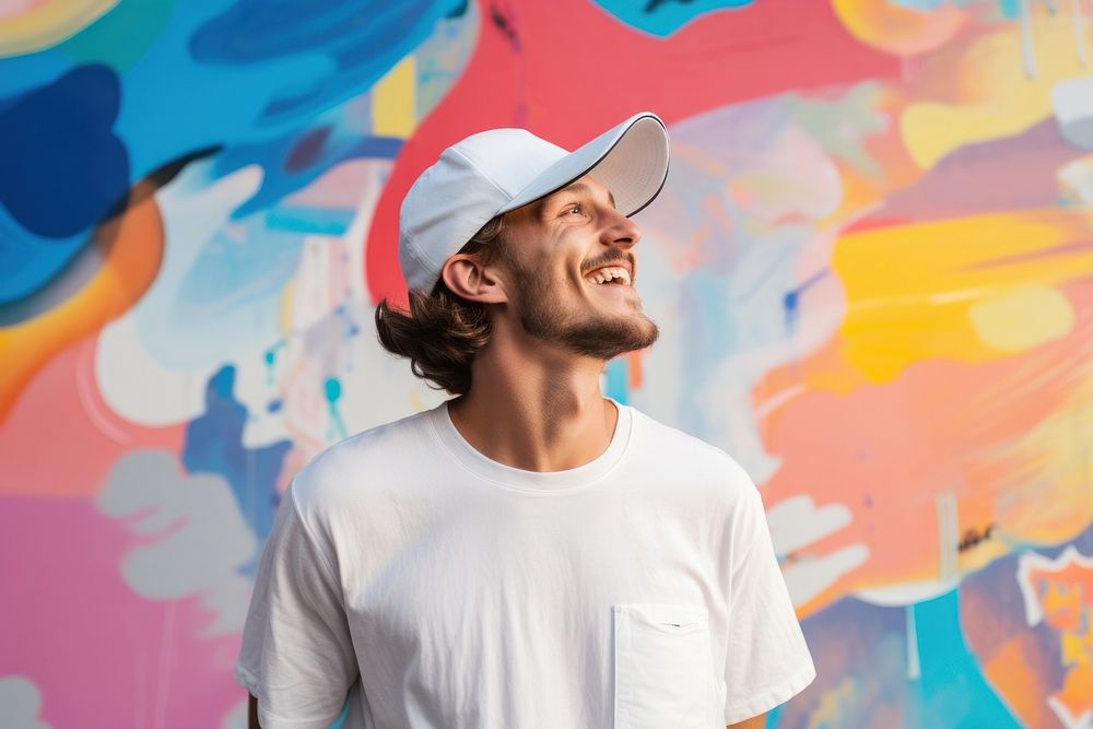 A man wearing white cap laughing adult smile.