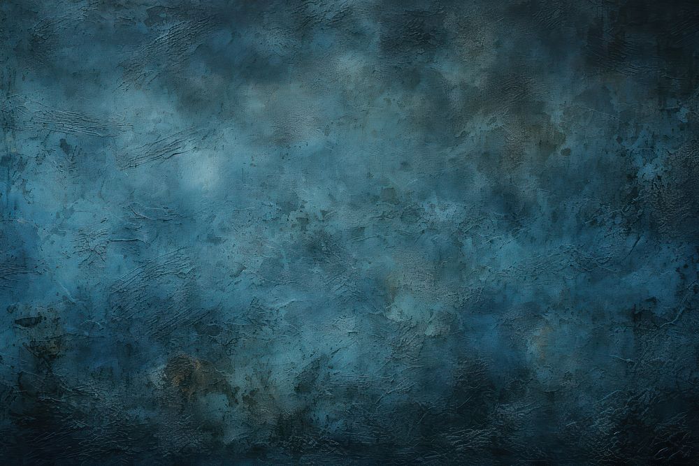 A dark black wall with light and dark blue paint backgrounds scratched weathered.