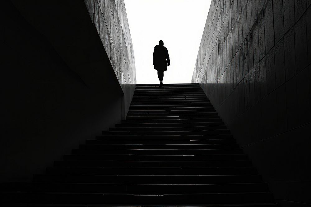 Silhouette person walking architecture monochrome.