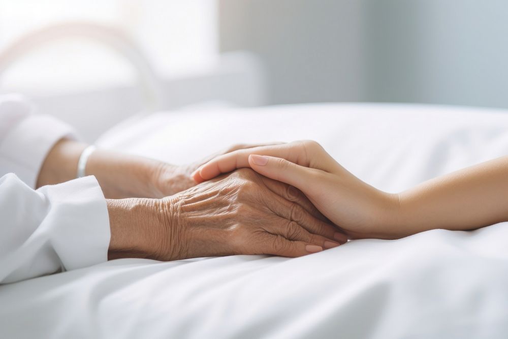 Nurse hand holding patient female adult. AI generated Image by rawpixel.