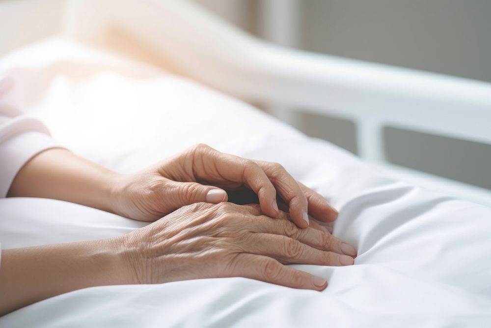 Nurse hand holding patient bed relaxation. AI generated Image by rawpixel.