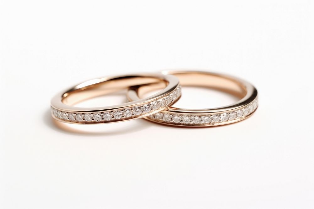 2 wedding rings with diamond jewelry silver white background. AI generated Image by rawpixel.