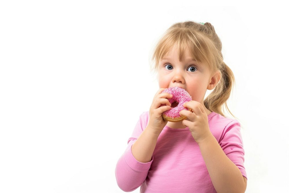 Little girl eating donut biting child white background.