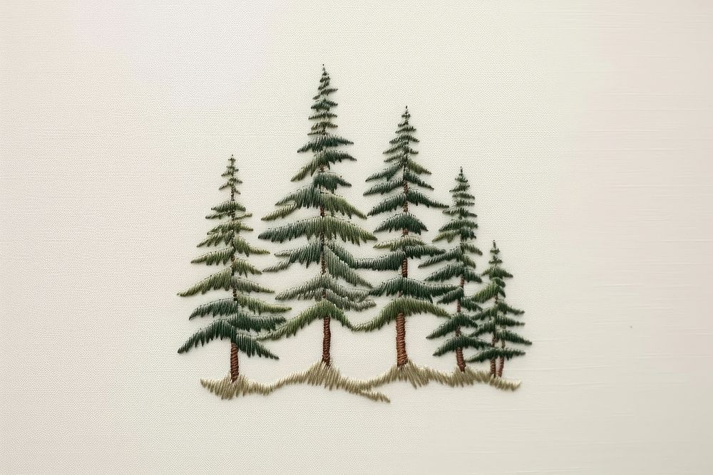 Embroidery white fabric pine tree pattern.