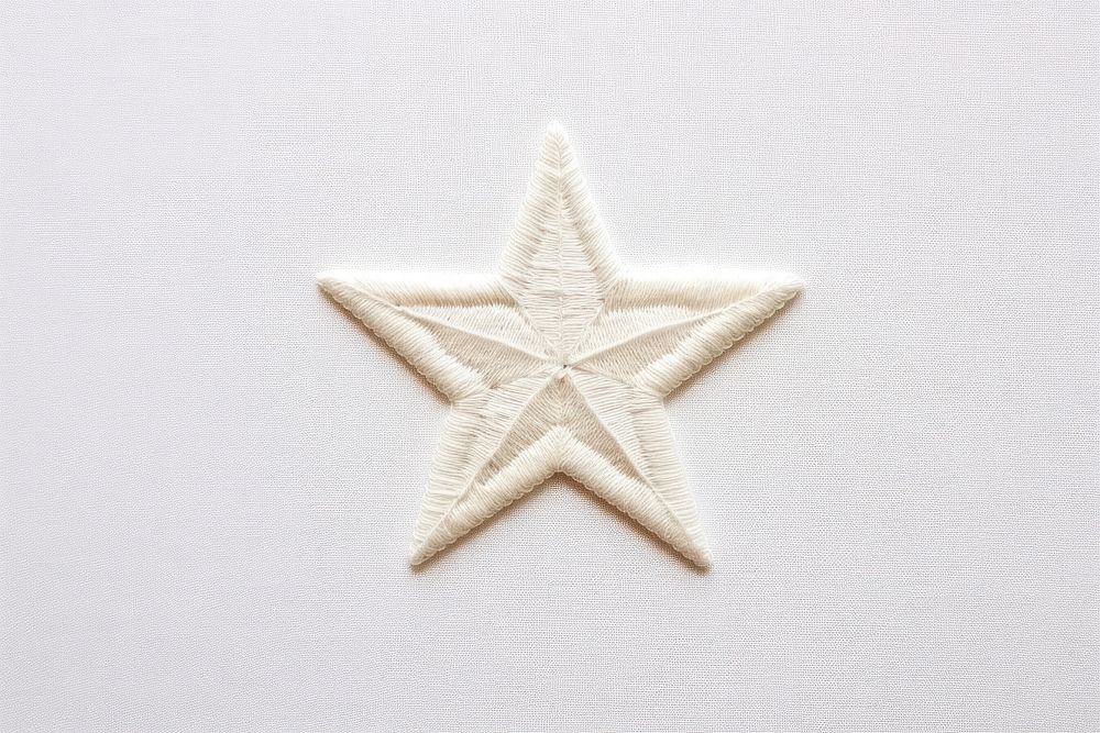 White fabric embroidery star simplicity.