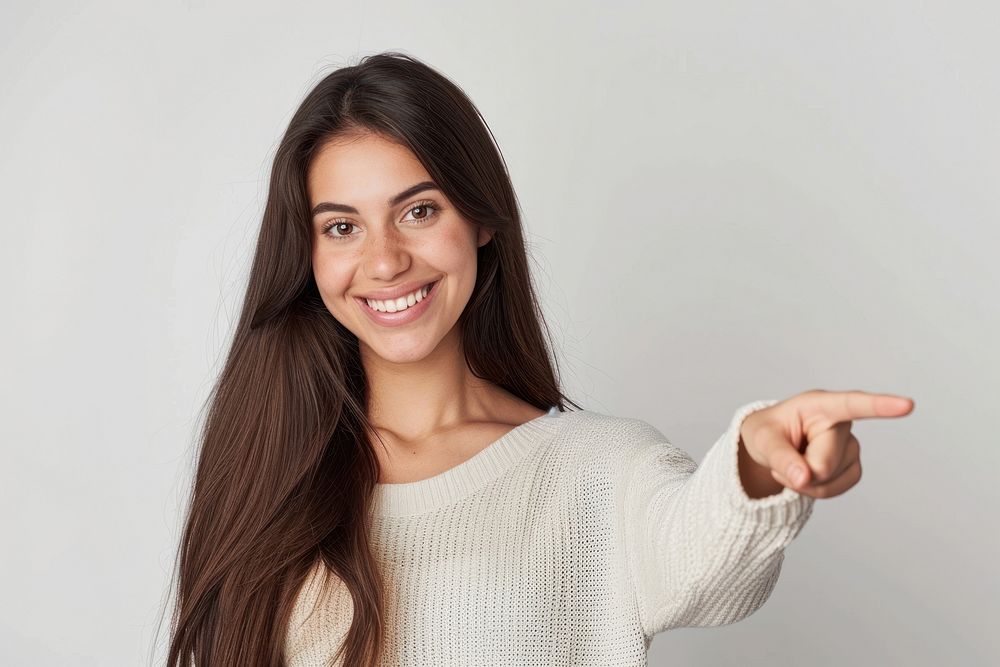 Woman over pointing to the side smile adult white background.