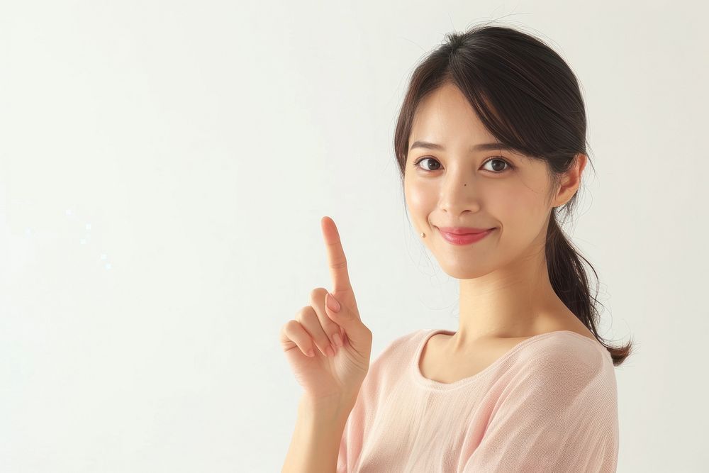 Woman happiness standing finger pointing portrait smile adult.