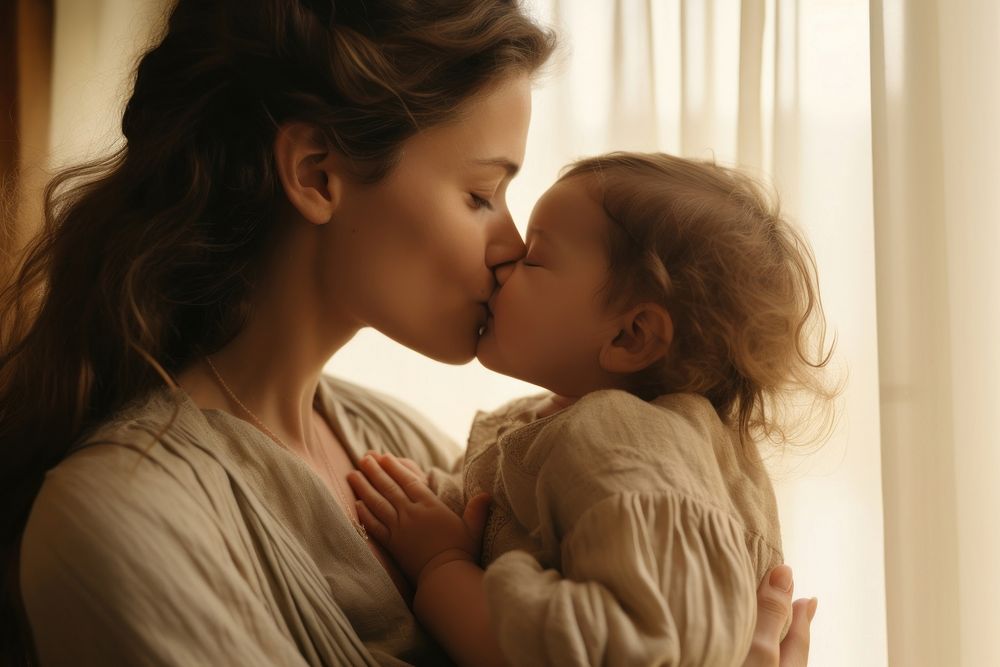 British mother kissing her little baby portrait adult photo. AI generated Image by rawpixel.
