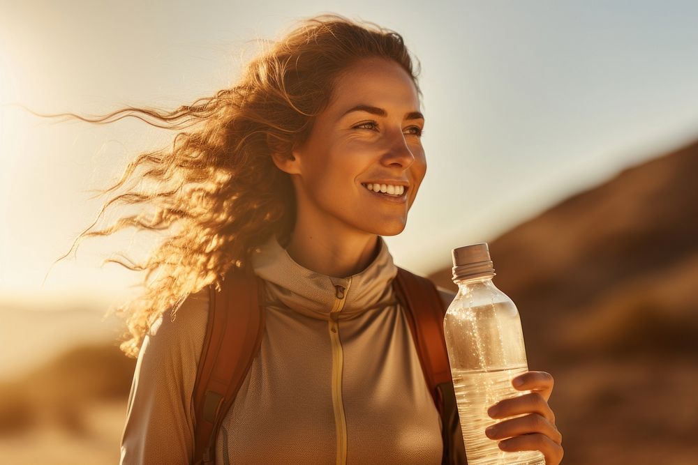 Woman holding water bottle sports smile adult. AI generated Image by rawpixel.