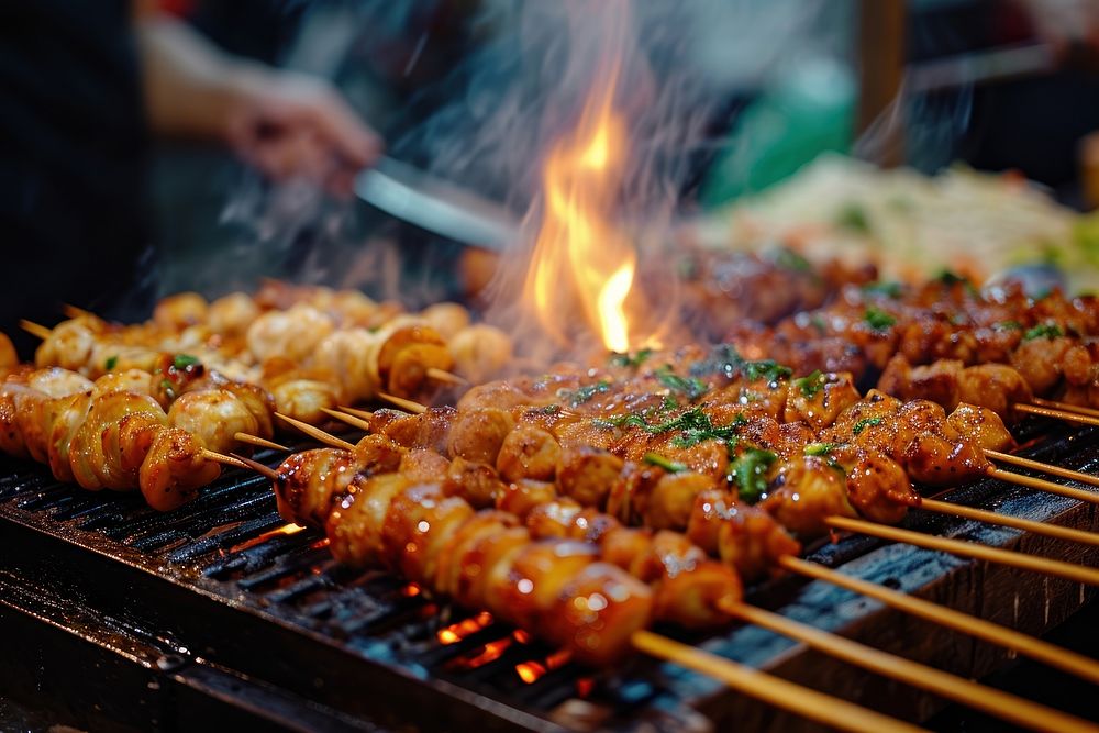 Extreme close up of Street food grilling cooking meat.