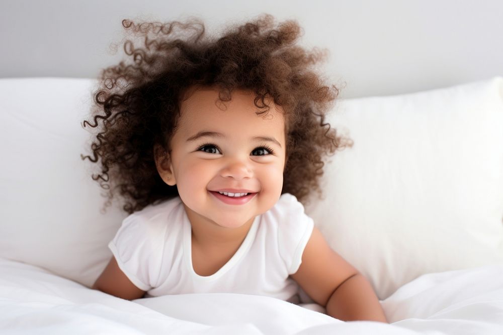 Mixed race baby girl portrait smiling child.