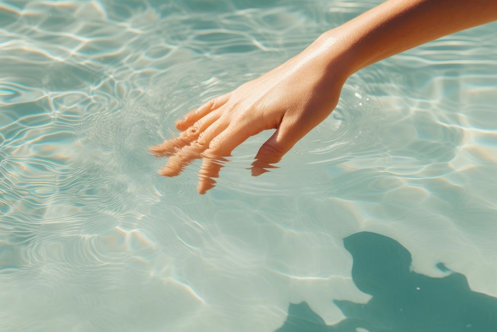 Swimming hand sunlight outdoors. AI generated Image by rawpixel.