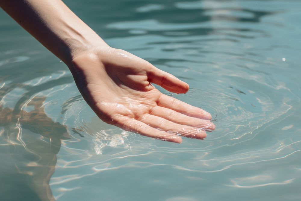 Hand touching swimming finger. AI generated Image by rawpixel.