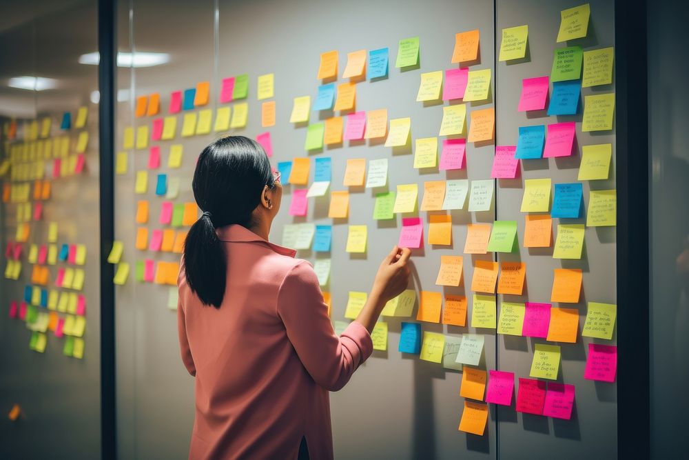 Hand put sticky note adult woman wall.