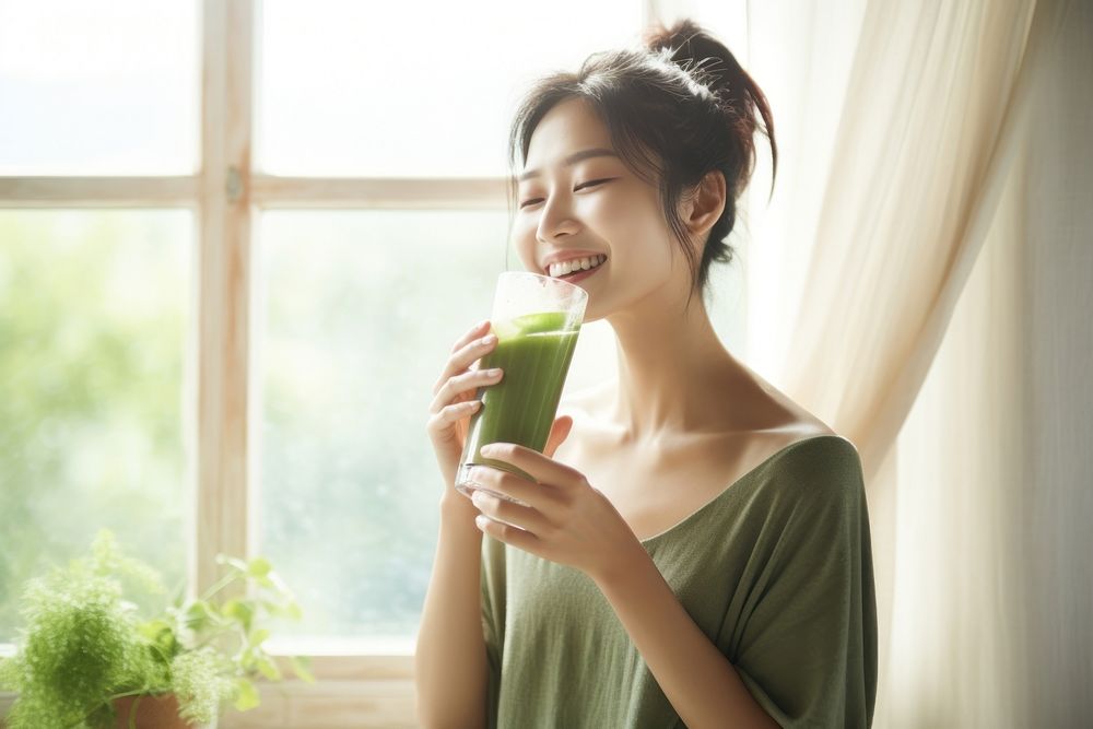 Woman drinking vegetable smoothie happy refreshment relaxation. AI generated Image by rawpixel.