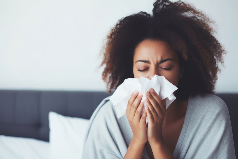 Women having flu and sneeze adult bed relaxation. AI generated Image by rawpixel.